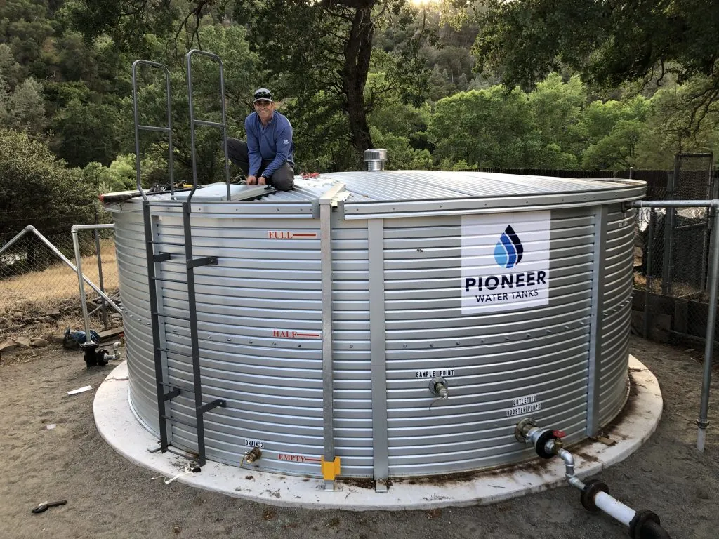 Pioneer Water Tanks installation — large cylindrical metal water tank